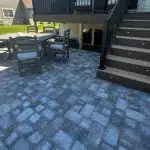 a patio with a table and chairs