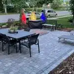 a patio with a table and chairs