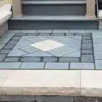 a stone floor with a diamond pattern
