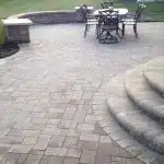 a patio with a table and chairs